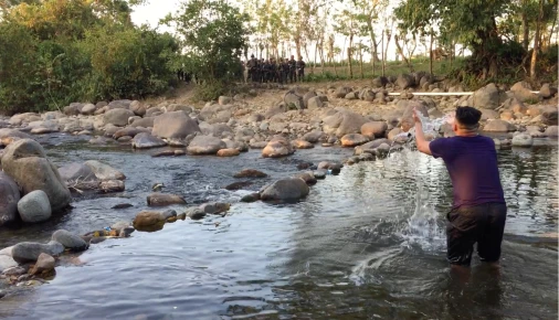 The Guapinol community (children, elders etc) and the delegates with Honduras Root Causes 2019 at the Guapinol River. On the other side of the river are the mining interests and the Honduran army with machine guns. Water Is Life.
https://www.flickr.com/p